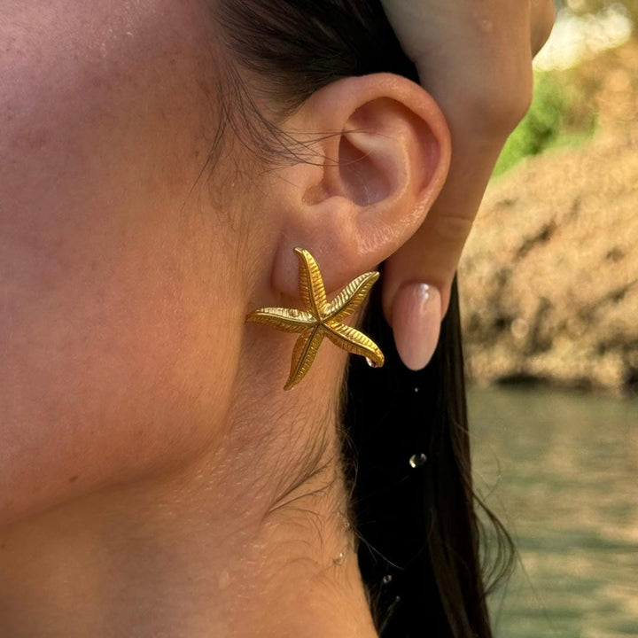 Elegante goldene Seestern-Ohrringe