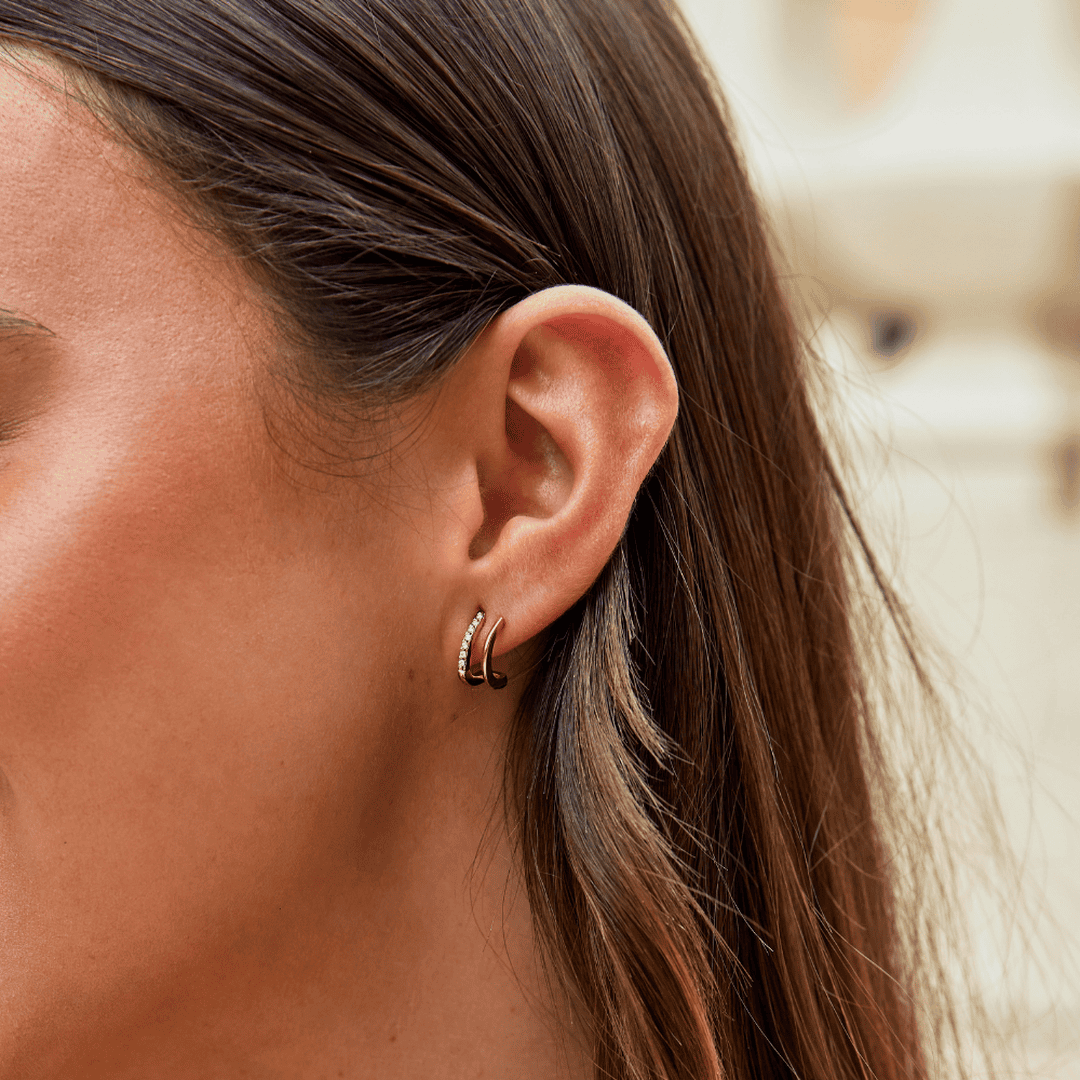 Krallen-Ohrringe aus Gold mit Kristall