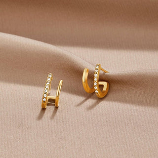 Krallen-Ohrringe aus Gold mit Kristall