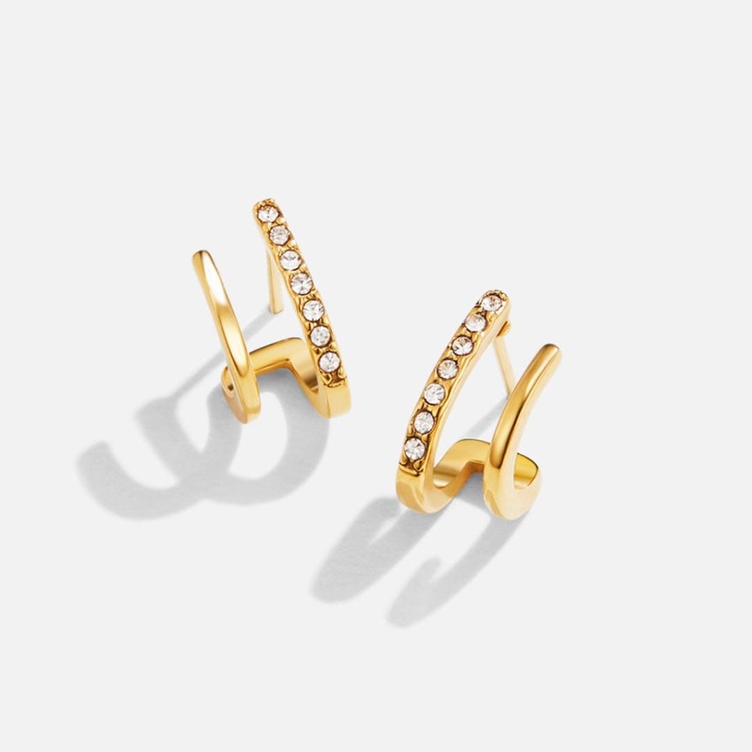 Krallen-Ohrringe aus Gold mit Kristall