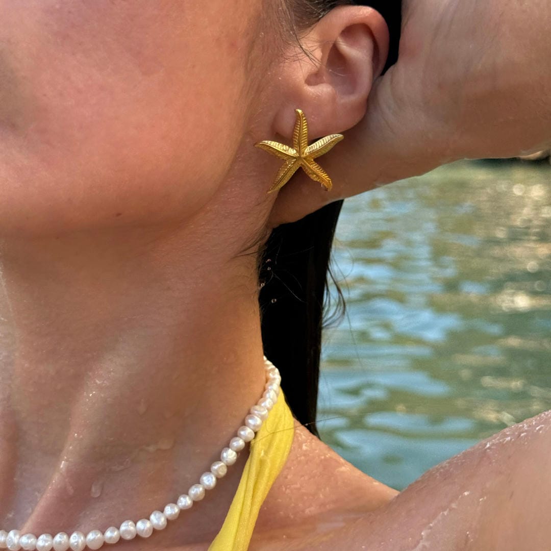 Elegante goldene Seestern-Ohrringe