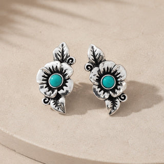 Glänzende Ohrringe mit Türkisblumen