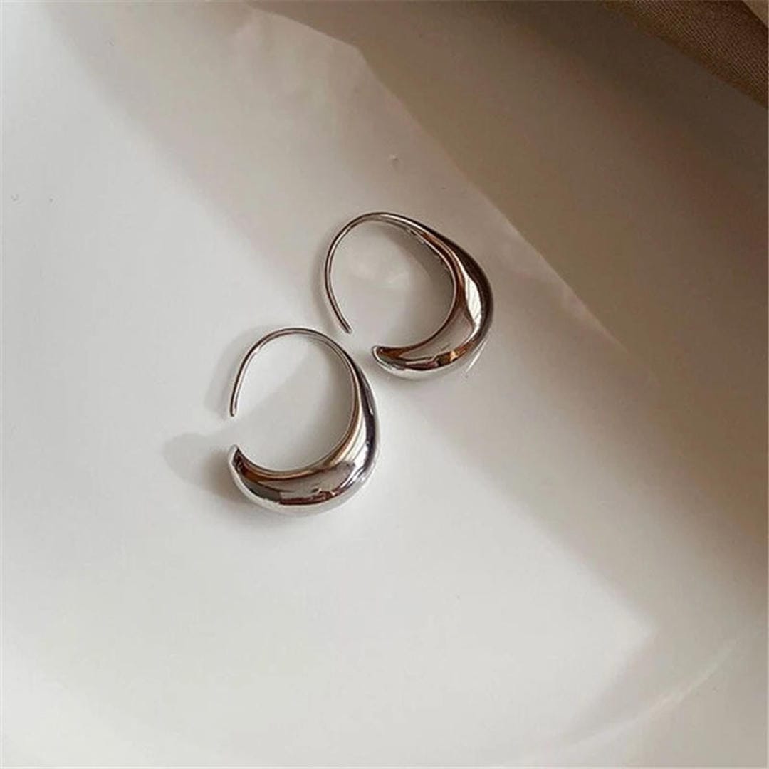 Ovale Creolen aus Gold und Silber