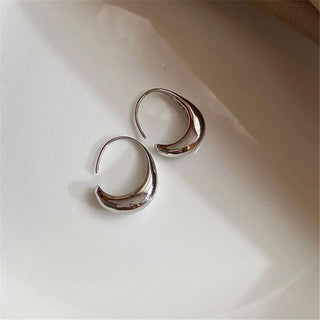 Ovale Creolen aus Gold und Silber