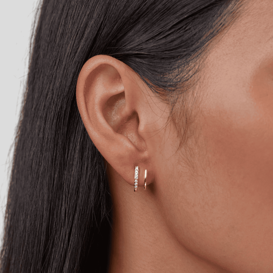 Krallen-Ohrringe aus Gold mit Kristall