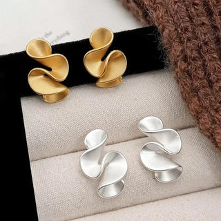 Ohrringe aus Sterlingsilber mit goldenen Blumen