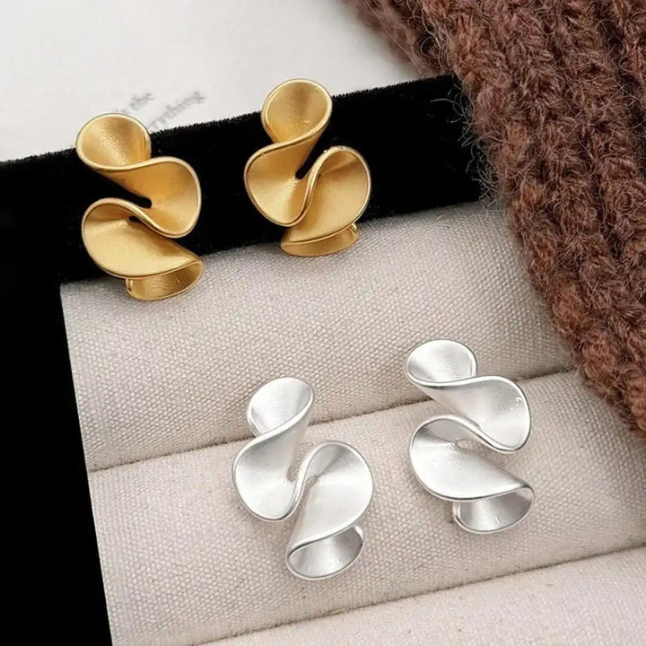 Ohrringe aus Sterlingsilber mit goldenen Blumen